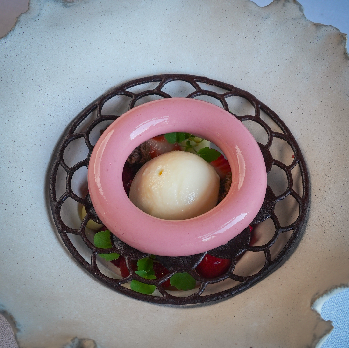 Food-safe Ecliptar silicone tuile mold placed in a dish flexible and durable mold perfect for creating intricate, crispy tuile garnishes in gourmet pastry applications.
