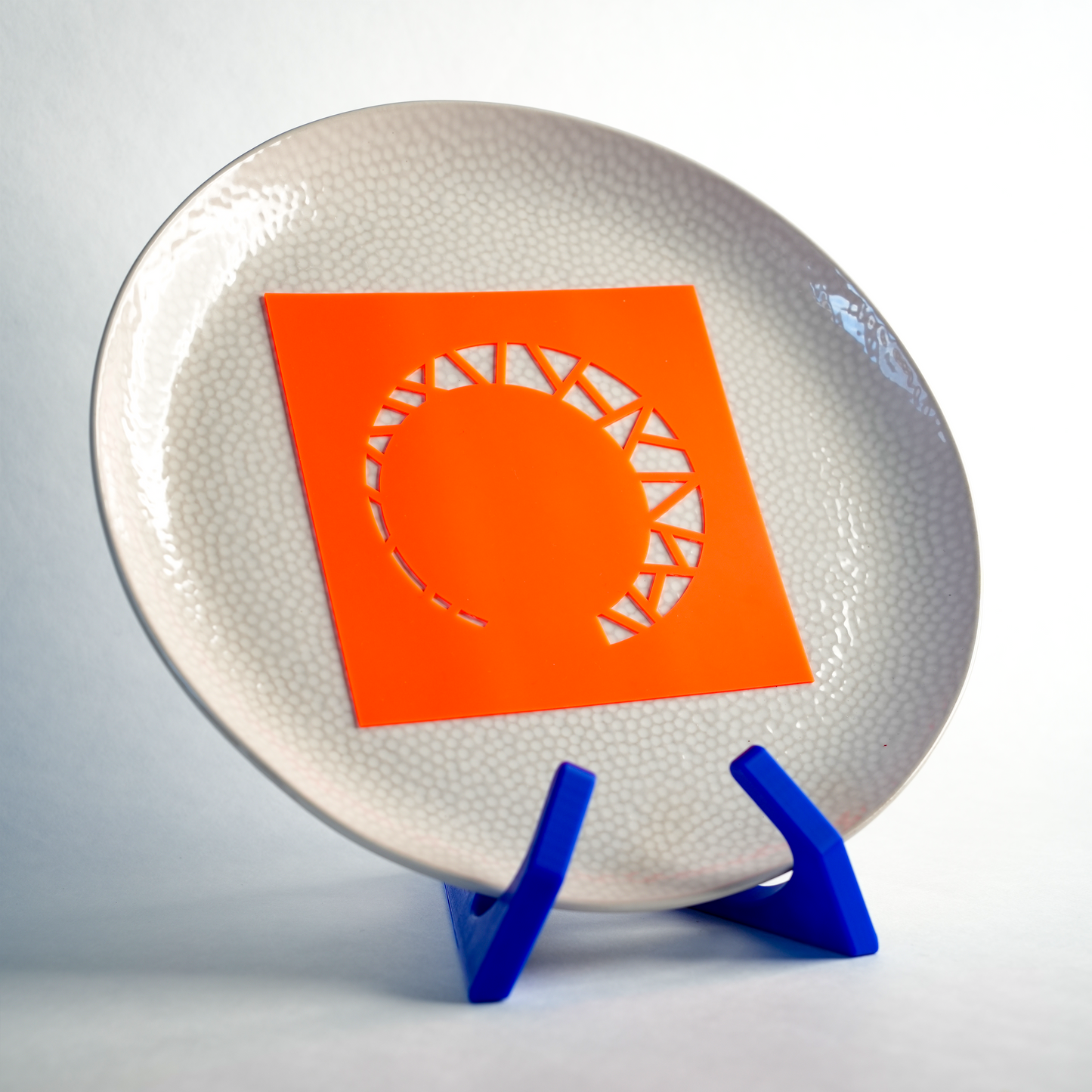 Silicone Moon Streaks stencil placed on a plate, ready to create a half-moon design with streaks