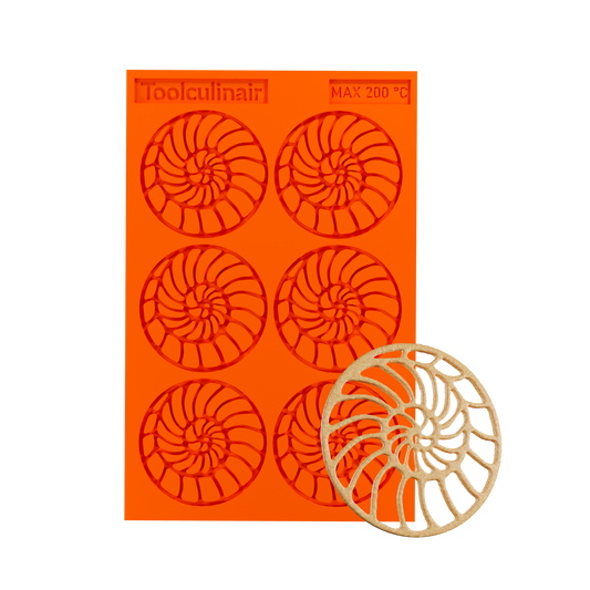 Photo of the Ammonite food safe silicone tuile mold alongside a matching tuile cookie, showcasing intricate spiral shell design ideal for sweet and savory pastry decorations.