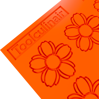 Close-up 3D render of an orange Toolculinair silicone cherry blossom tuile mold, showing a corner of the mold with the Toolculinair logo clearly visible.