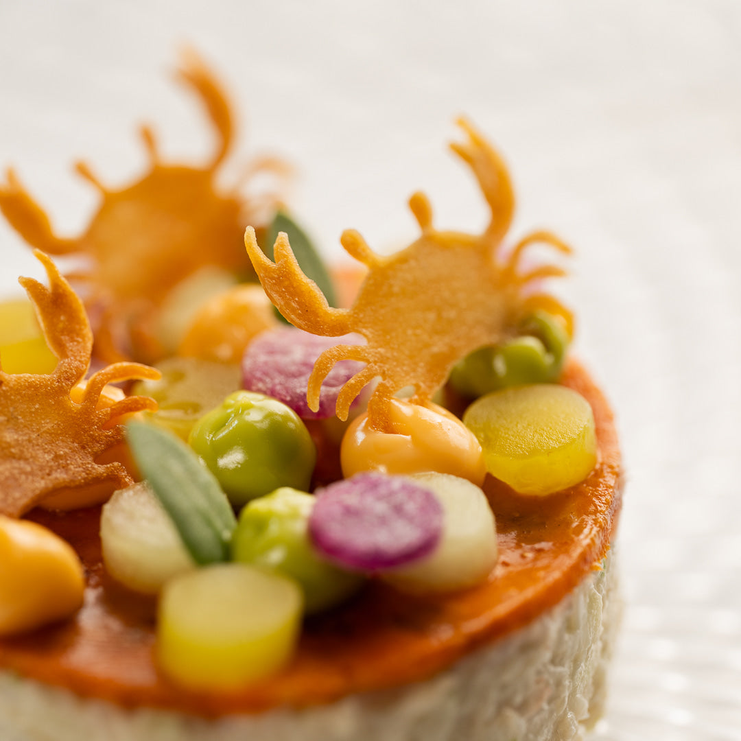 Close-up of tuile from Toolculinair Crablet silicone tuile mold on crab appetizer – photo by Platefully
