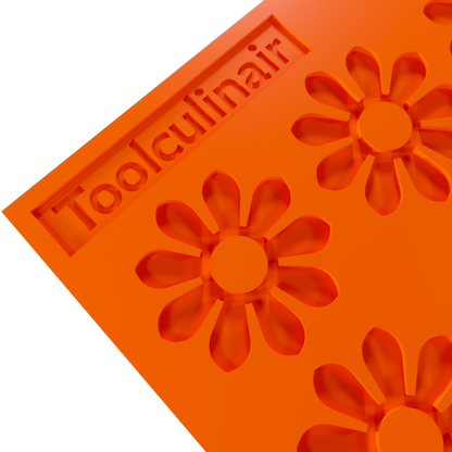 Close up photo of the Enneaflower food safe silicone tuile mold, highlighting detailed nine-petal floral design and flexible material perfect for delicate pastry creations.