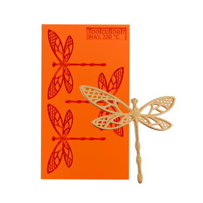 Photo of the Flydraze food safe silicone tuile mold alongside a highly detailed tuile cookie resembling a realistic dragonfly, perfect for intricate sweet and savory pastry decorations.