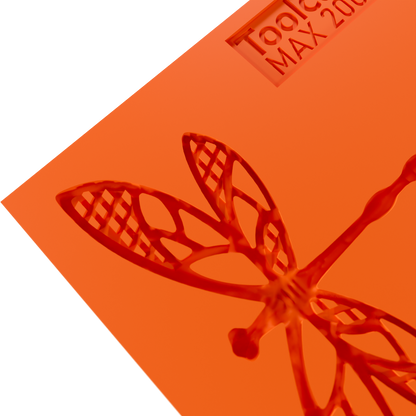 Close up photo of the Flydraze food safe silicone tuile mold, highlighting the intricate dragonfly design and flexible material perfect for detailed pastry decorations.