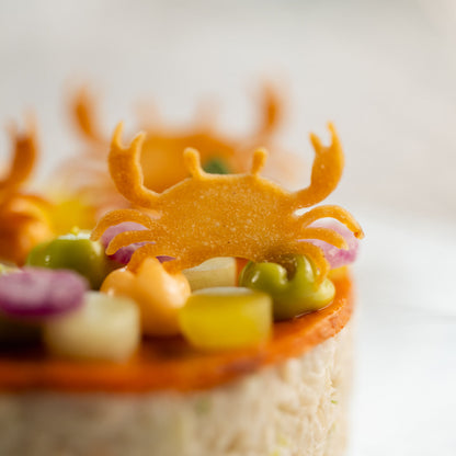 Front close-up of tuile on crab appetizer using Toolculinair Crablet silicone tuile mold – photo by Platefully