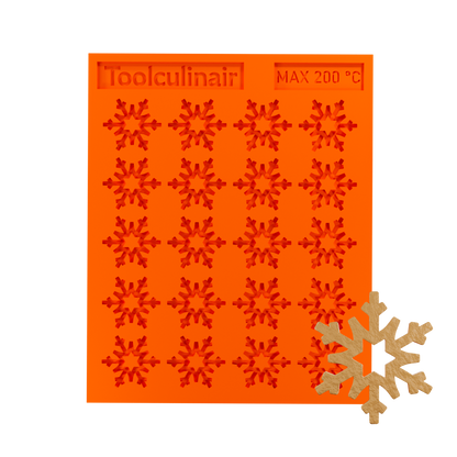 Frost star silicone tuile mold with a tuile cookie, ideal for baking decorative and detailed pastries