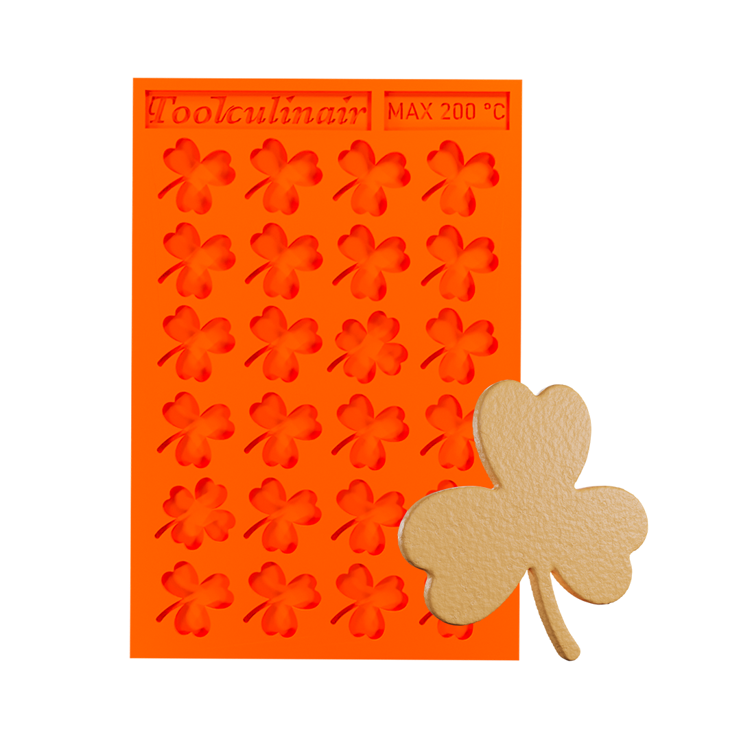 Photo of the Green Luck food safe silicone tuile mold with a matching tuile cookie, featuring a nature-inspired design ideal for sweet and savory pastry decorations.