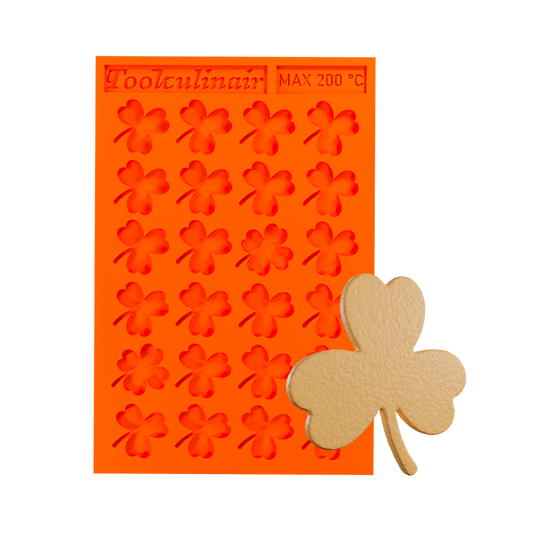 Photo of the Green Luck food safe silicone tuile mold with a matching tuile cookie, featuring a nature-inspired design ideal for sweet and savory pastry decorations.
