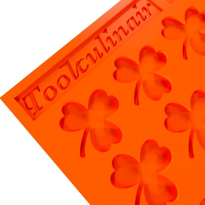 Close up photo of the Green Luck food safe silicone tuile mold, highlighting detailed nature-inspired design and flexible material perfect for elegant pastry creations.