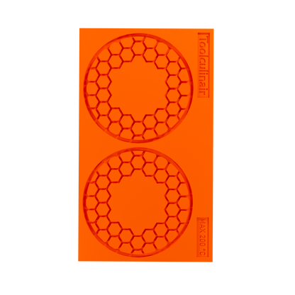 Top view photo of the Hiveorb food safe silicone tuile mold, highlighting the detailed honeycomb cavities perfect for crafting elegant sweet and savory pastry decorations.