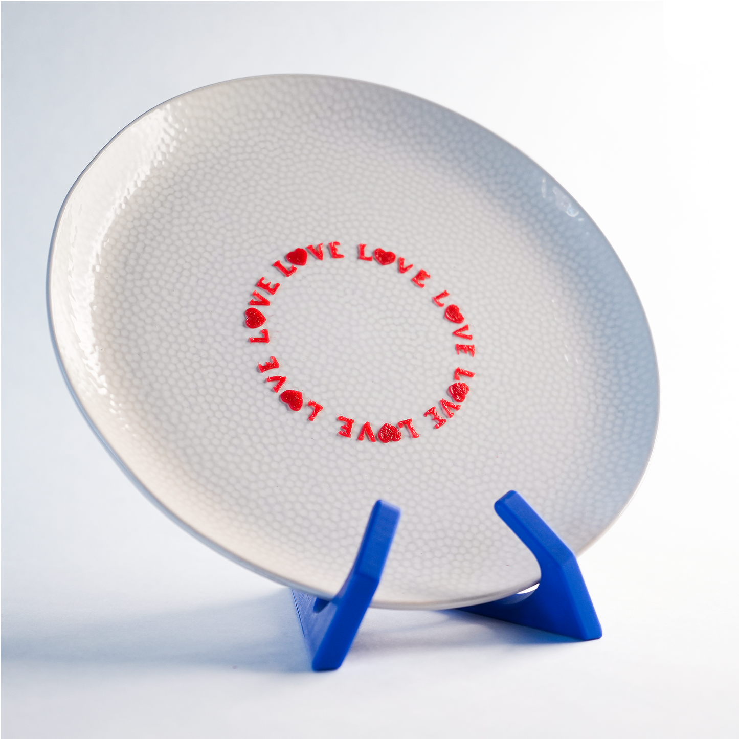 Toolculinair Looped Love silicone stencil result on plate with strawberry gel