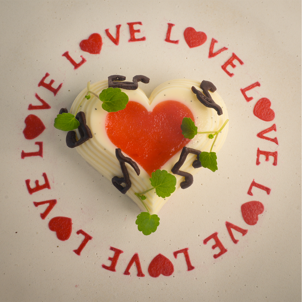 Toolculinair Looped Love stencil result around plated dessert with strawberry gel