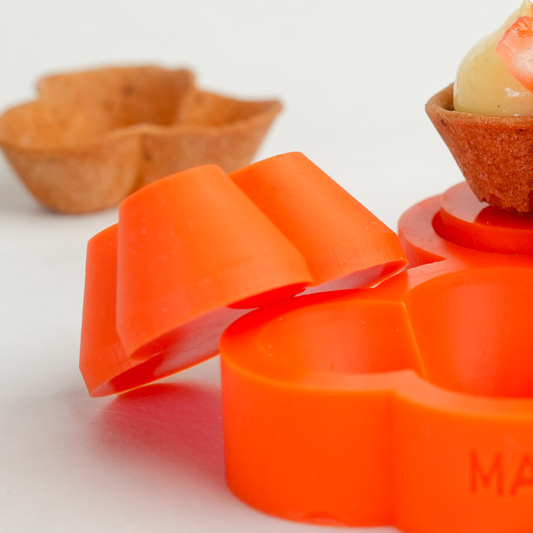 Close up photo of food safe silicone caps for tartelette molds showing flexible and durable design for professional pastry use.