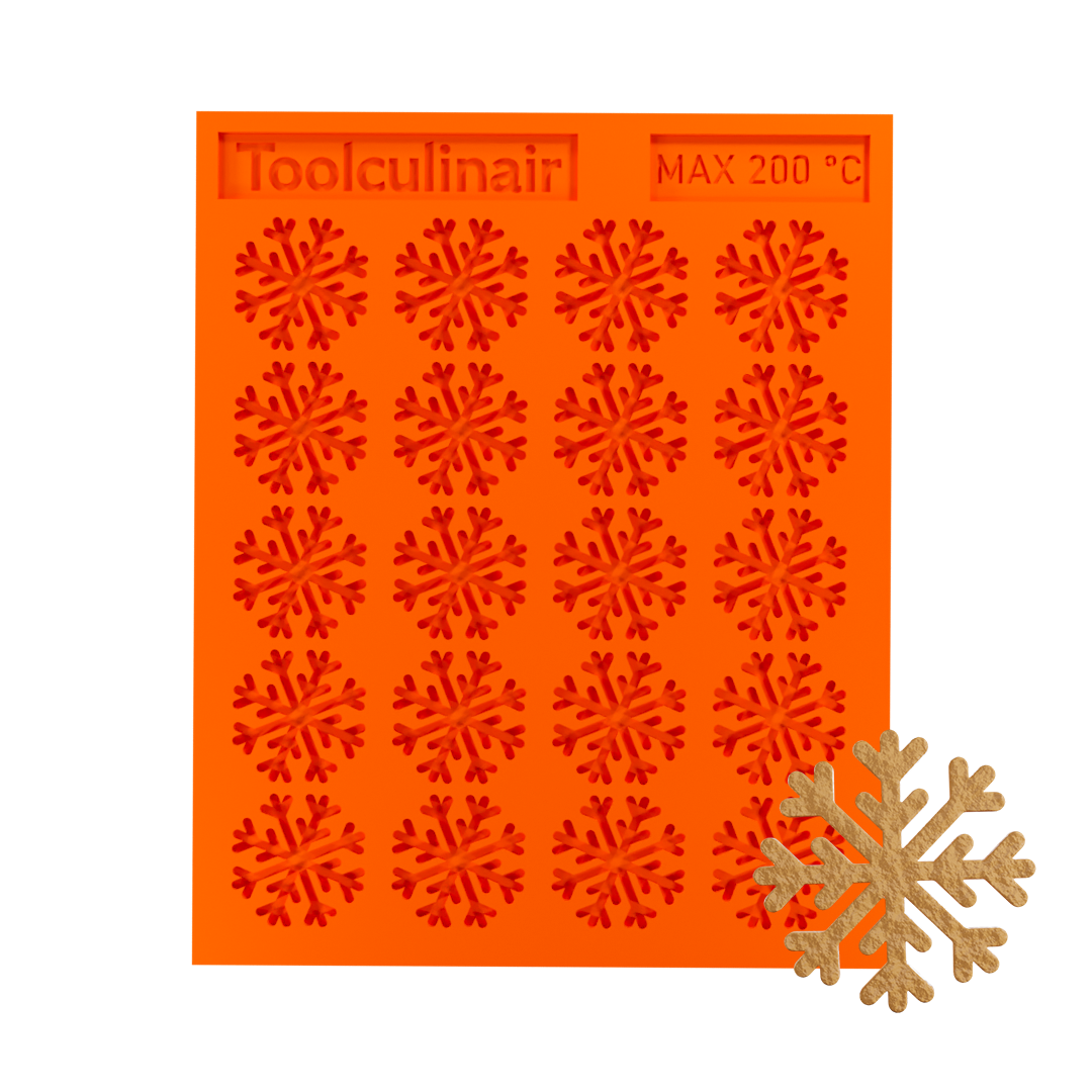 Snowflake silicone tuile mold with a tuile cookie, ideal for baking decorative and detailed pastries