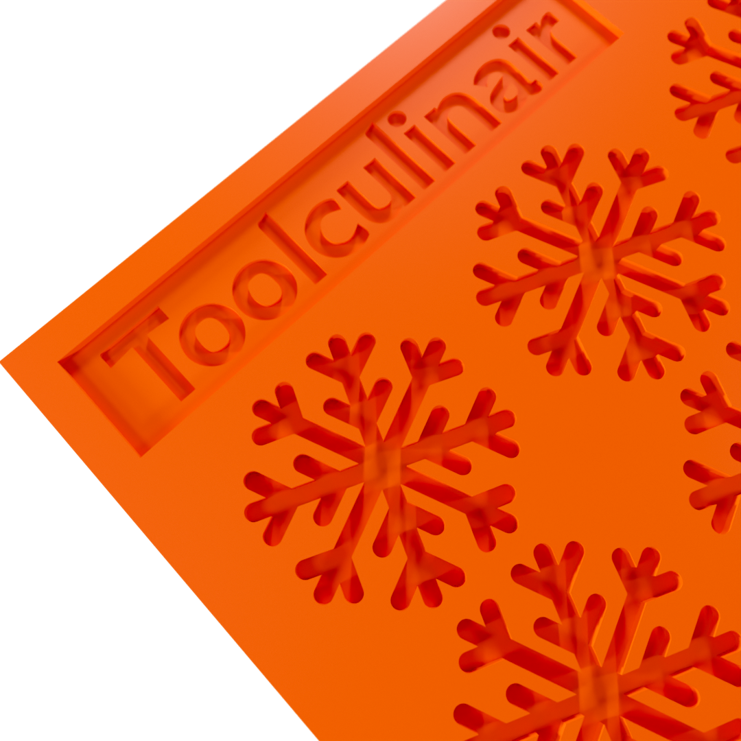 Close-up of a snowflake silicone tuile mold, showing intricate patterns for creating decorative cookies and pastries