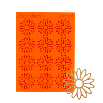 3D render of an orange Toolculinair silicone sunflower line art tuile mold with visible logo, showing a sample tuile in the bottom right corner representing the final shape after demolding.