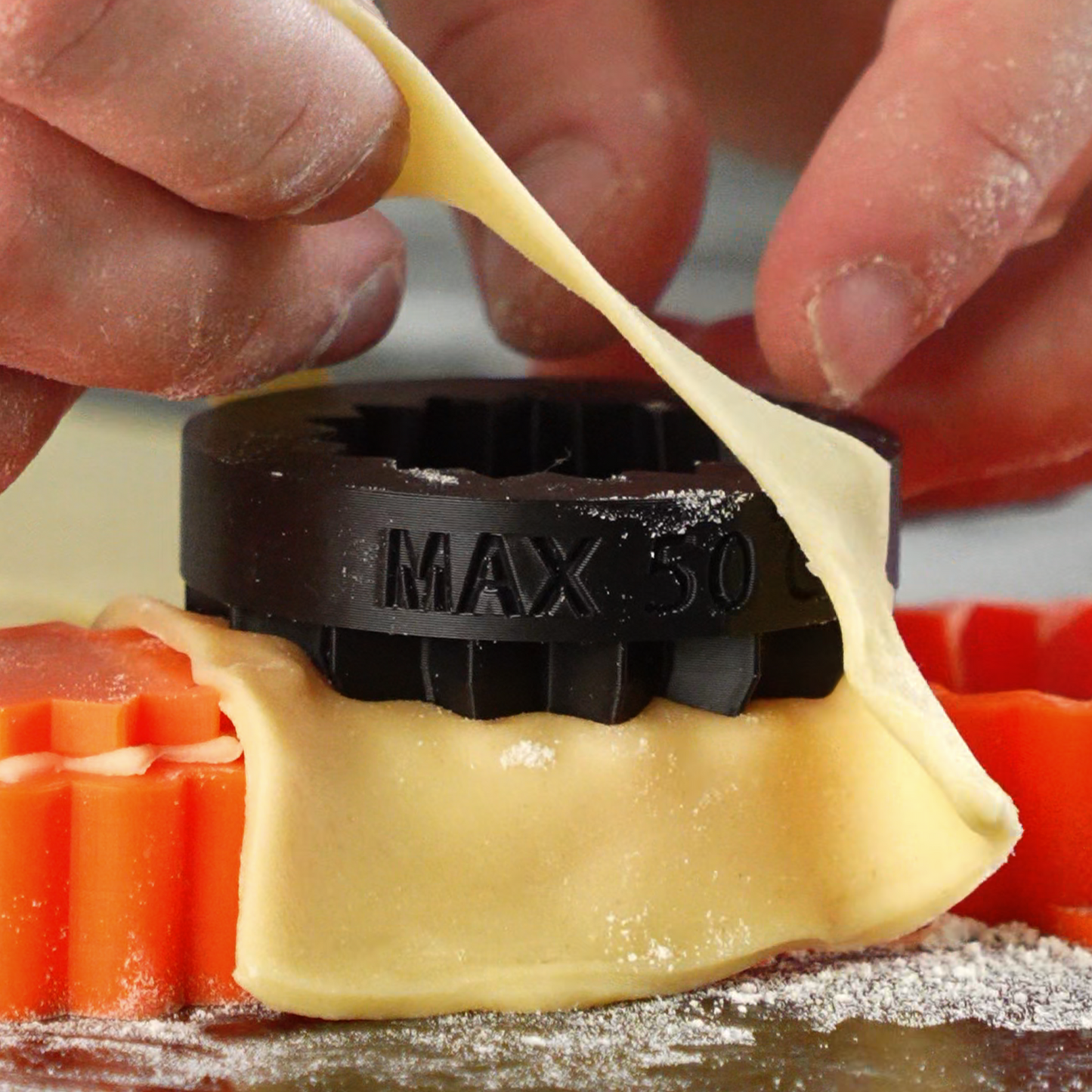 Close-up action photo of a tartelette cutter in use sharp and ergonomic kitchen tool designed for precise pastry shell cutting in professional baking.