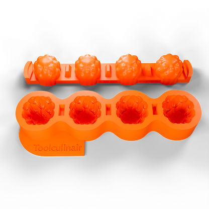 3D render of a two-part orange silicone mold placed side by side in a slightly angled top view, featuring the Toolculinair logo during product visualization.