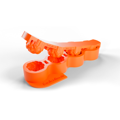 3D render of an orange Toolculinair artichoke dome silicone mold showing the unmolding process, with the top part being lifted upward to reveal how the shape is released, including visible Toolculinair logo.
